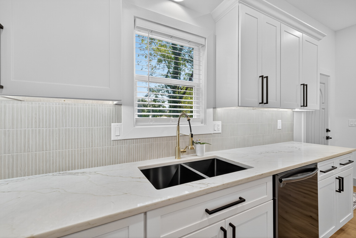 Kitchen renovation with white shaker cabinets and gray tile backsplash in Gwinnett County, GA